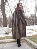 Long raccoon-fur coat with high collar and structured sleeves, dark brown