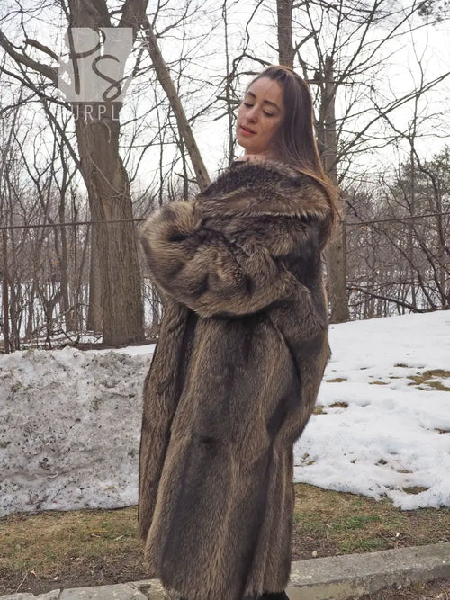 Raccoon fur coat with wide hood collar and toggle front, side view in brown fur