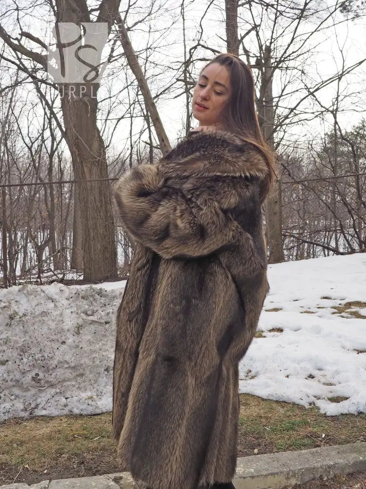 Raccoon fur coat with wide hood collar and toggle front, side view in brown fur