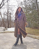 Reversible fur coat with hood, dark outer side with tan fur lining at cuffs and hem