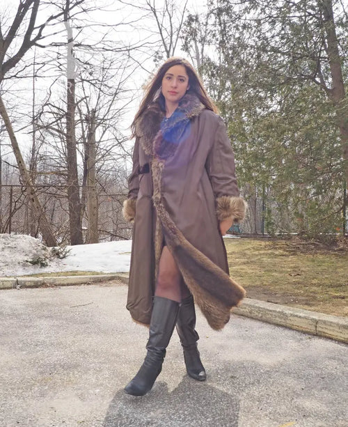 Reversible fur coat with hood, dark outer side with tan fur lining at cuffs and hem