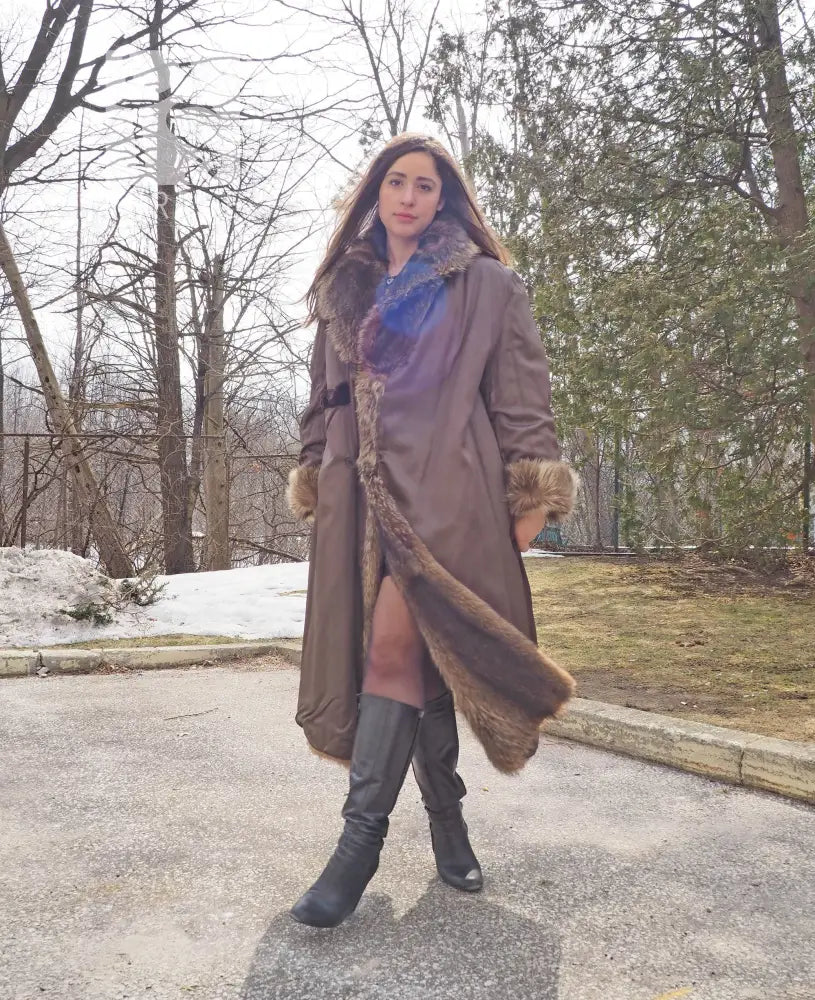 Reversible fur coat with hood, dark outer side with tan fur lining at cuffs and hem