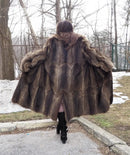 Long raccoon-fur coat back view with voluminous shoulders and full skirt hem