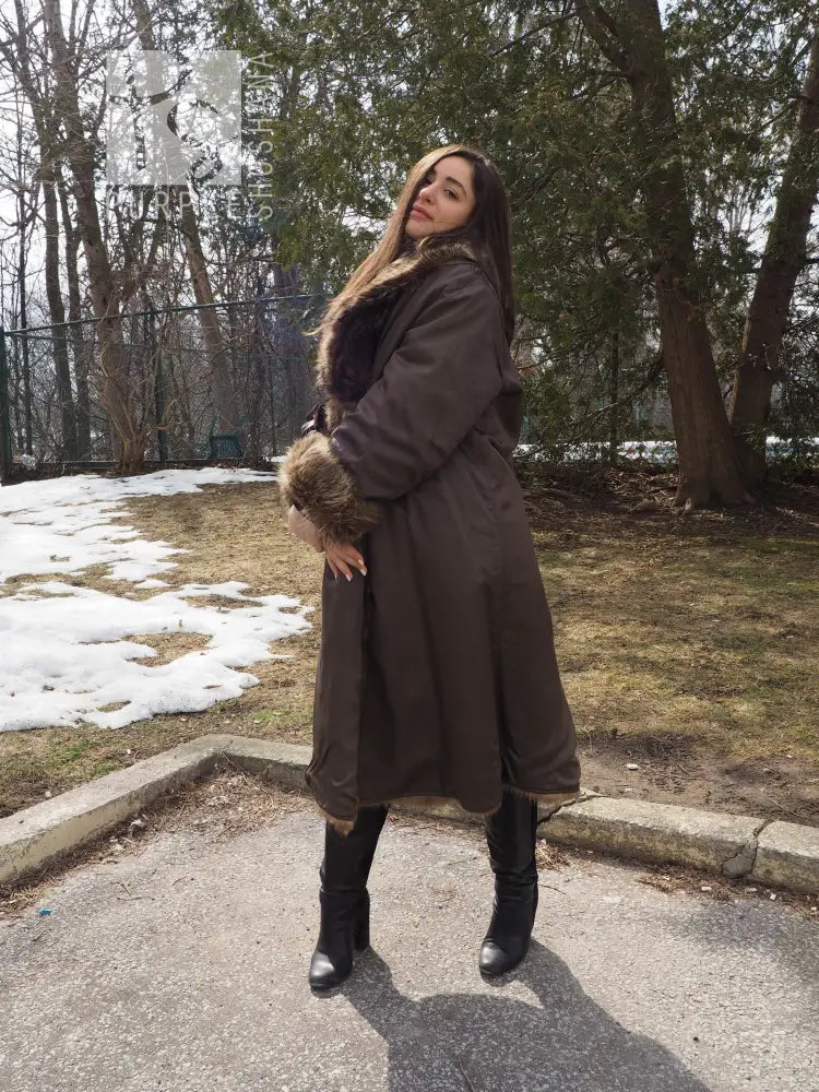 Reversible fur coat showing dark outer side with tan fur collar and cuff trim