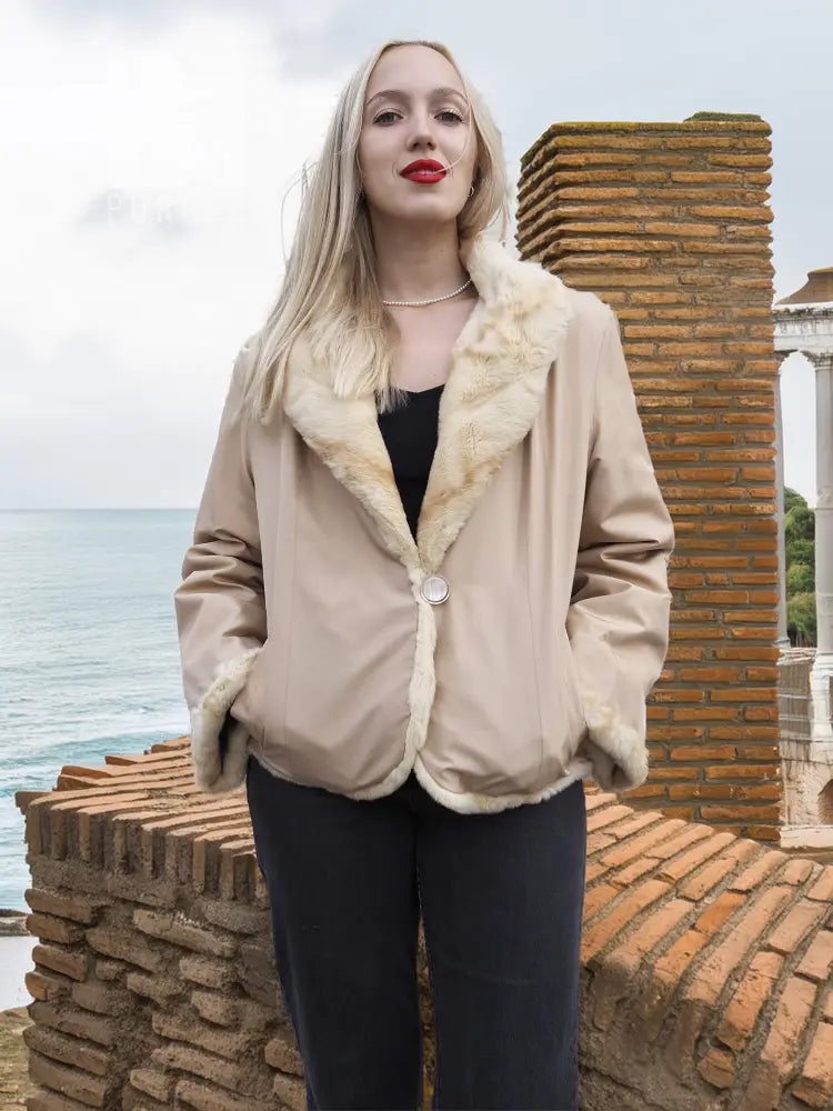 Tan mink fur jacket with cream sheared fur collar and snap front