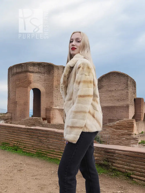 Light beige mink fur jacket with long sleeves and stand collar, side view