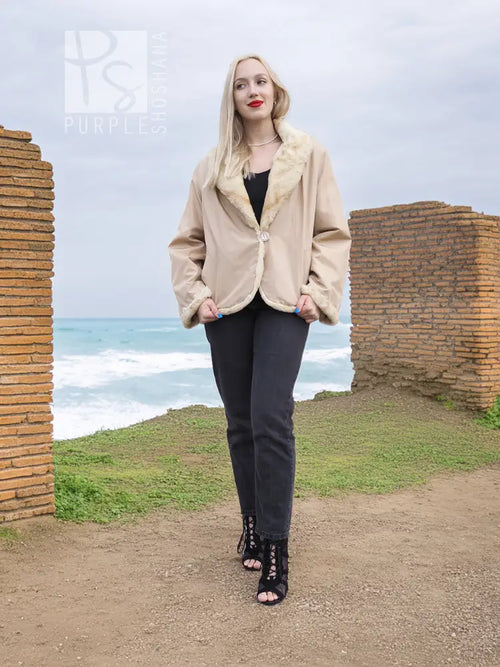 Tan mink fur jacket with cream sheared fur collar and snap front, full view