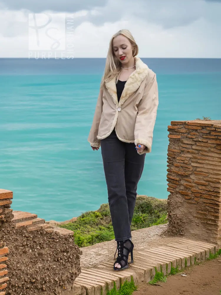 Light beige mink fur jacket with button front and plush collar, hands at sides