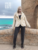Reversible sheared mink fur jacket, cream; worn over dark top, open neckline