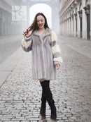 Light gray mink fur coat with wide collar and cream striped sleeves, knee-length