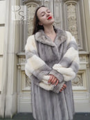 Mink fur coat in light gray with wide collar and cream block sleeves, mid-length
