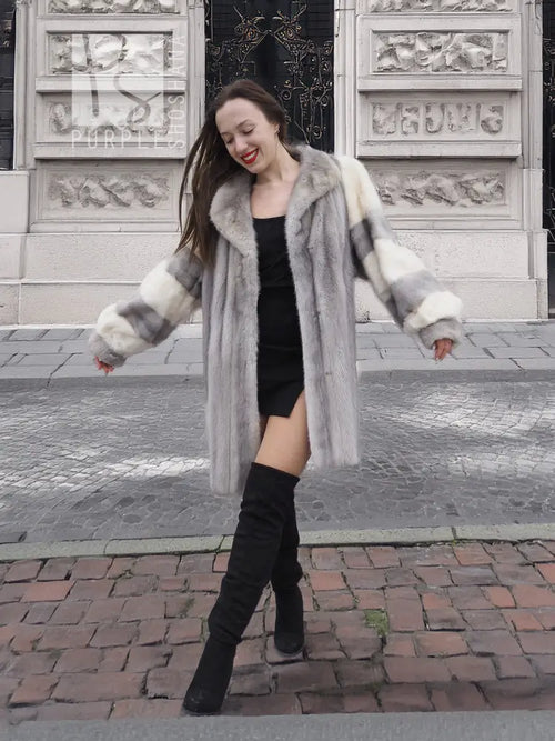 Light gray mink fur coat with cream cuffs and hood, open front, knee length