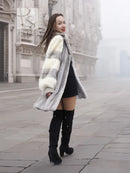Mink fur coat with light and dark fur panels, open front and wide cuffs