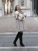 Light gray mink fur coat with cream plaid-style panels, hood, and knee length