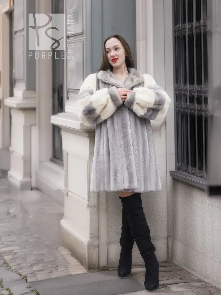 Light gray mink fur coat with wide collar and cream sleeve accents, standing front