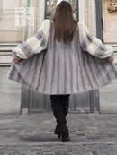 Back view of light gray mink fur coat with wide collar and cream sleeve cuffs