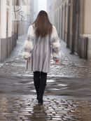 Mink fur coat with light fur cuffs and wide collar, back view with skirt-length hem.
