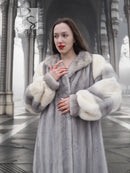 Mink fur coat with large fur cuffs and structured collar, buttoned front view.