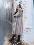 Light gray mink fur coat with long sleeves and open front, mid-calf length.