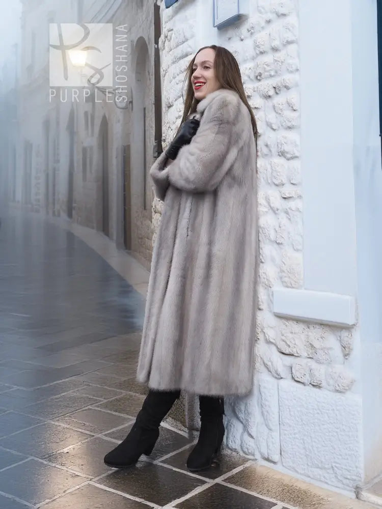 Light gray mink fur coat with long sleeves and open front, mid-calf length.