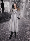 Sapphire Grey Mink Fur Coat S/M Excellent featured in a misty urban setting. Full-length fur coat exudes vintage charm and sustainable luxury.