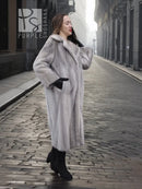 Grey mink fur coat with hood and front pockets, shown from side angle.
