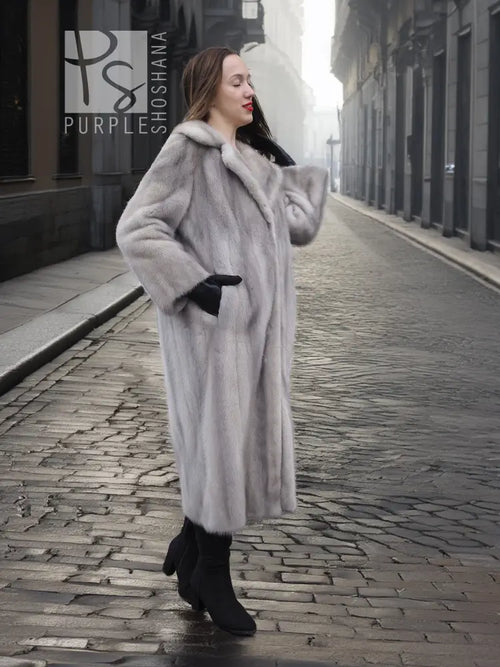Grey mink fur coat with hood and front pockets, shown from side angle.