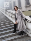 Light gray mink fur coat with hood and open front, long sleeves and soft drape.