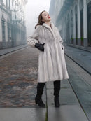 Light gray mink fur coat with stand collar and long sleeves, full-length front view