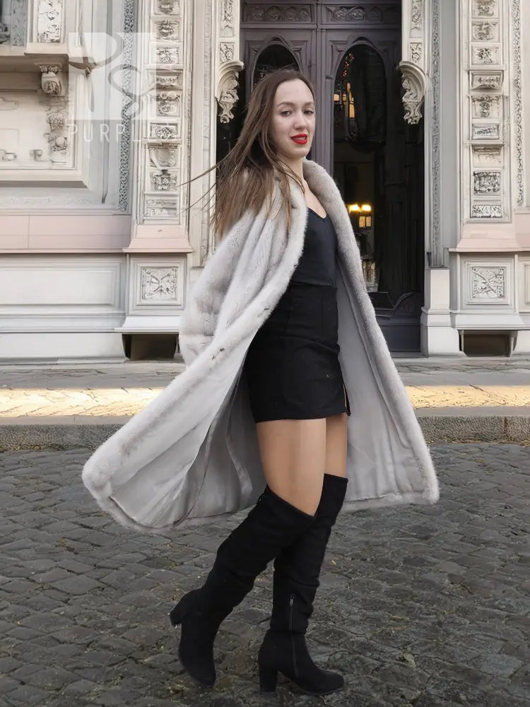 Light gray mink fur coat with open front, long sleeves, paired with black gloves