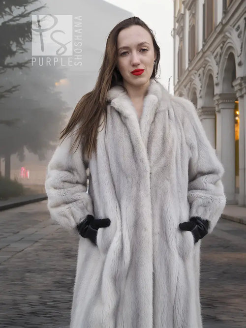 Light gray mink fur coat with stand collar and two-tone cuffed sleeves