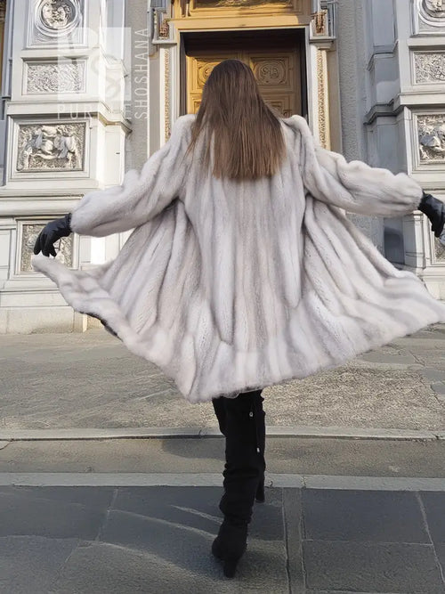 Light gray mink fur coat, rear view with flared hem and long sleeves