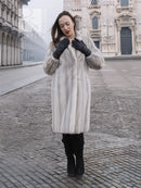 Light gray mink fur coat with stand collar, long sleeves, and soft textured finish