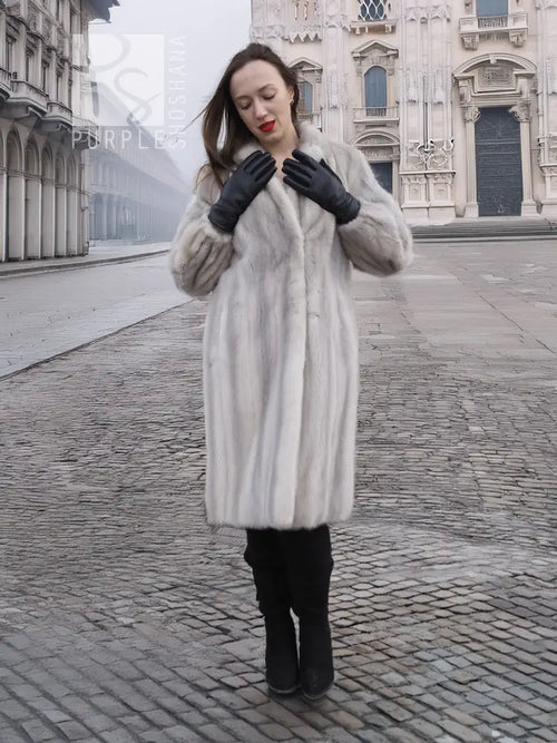 Light gray mink fur coat with stand collar, long sleeves, and soft textured finish