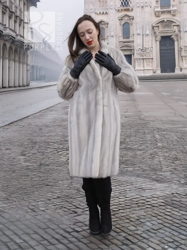 Light gray mink fur coat with stand collar, long sleeves, and soft textured finish
