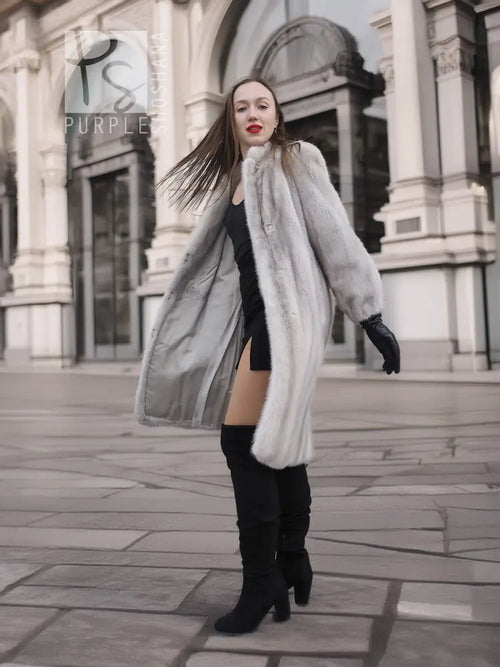 Light gray mink fur coat, open front with long sleeves and black gloves.