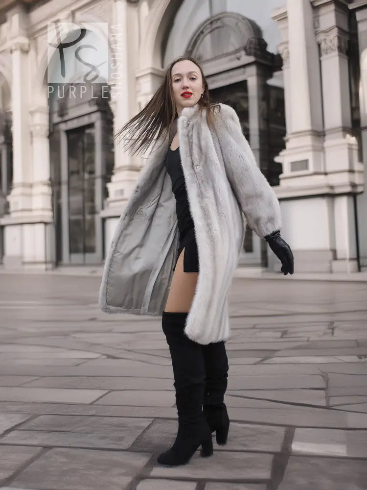 Light gray mink fur coat, open front with long sleeves and black gloves.