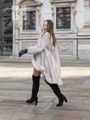 Light gray mink fur coat, knee-length swing hem, stand collar, waist tie detail