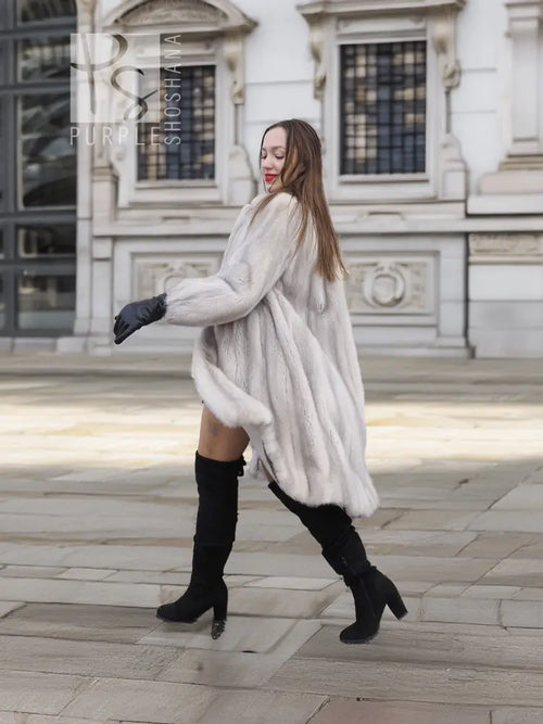 Light gray mink fur coat, knee-length swing hem, stand collar, waist tie detail