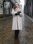 Light gray mink fur coat with full-length cut and stand collar