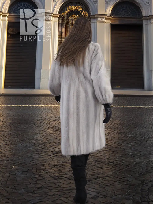 Light gray mink fur coat with stand collar, long straight silhouette, back view