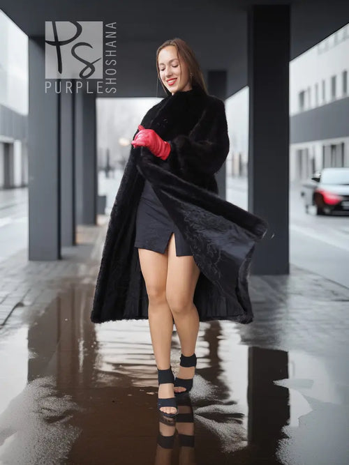 Black mink fur vintage coat, walking side view with red gloves