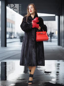 Black mink fur vintage coat, front view with red gloves and red handbag
