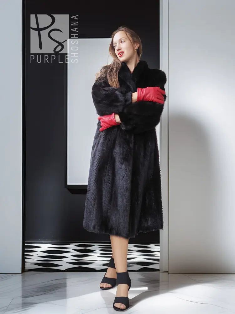 Vintage dark mink fur coat with wide collar and side slit, red gloves.