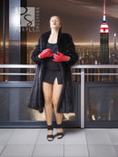 Vintage dark mink fur coat with wide collar, red gloves, mid-calf length.