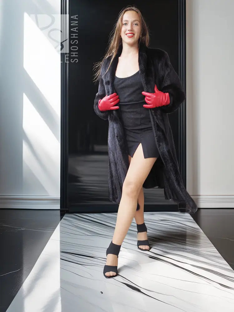 Black mink fur coat with open front and long sleeves, worn with gloves