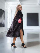 Vintage dark mink fur coat with wide collar and side slit, red glove.
