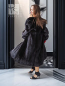 Vintage dark mink fur coat with wide collar, full sleeves, side view.