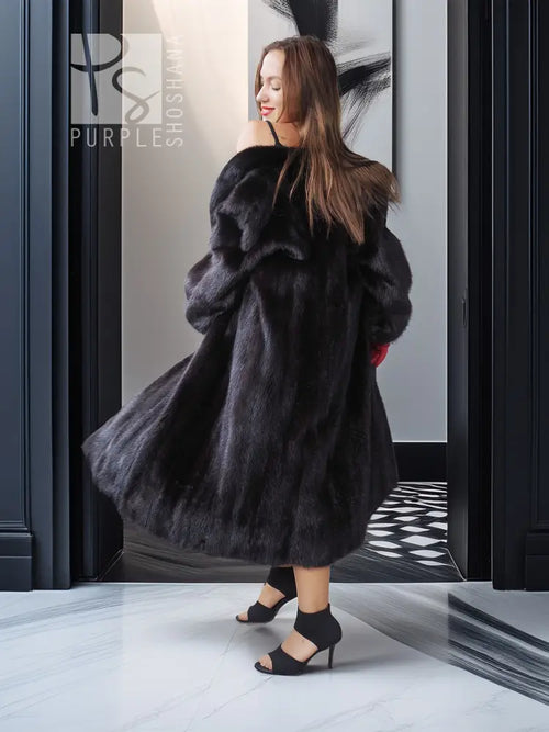 Vintage dark mink fur coat with wide collar, full sleeves, side view.
