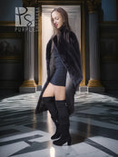Black mink fur coat with wide collar and knee-length hem, side view